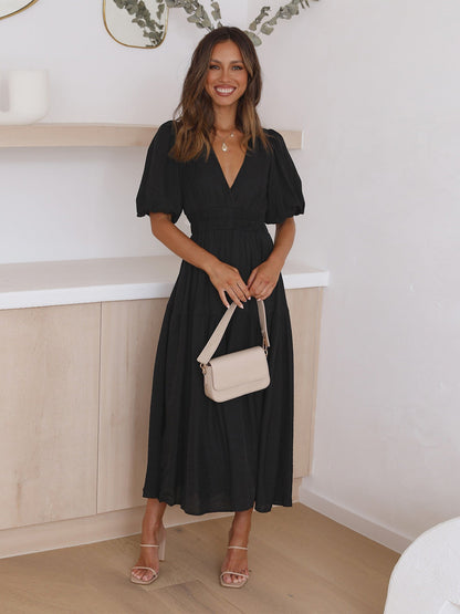 Dames midi-jurk met V-hals en pofmouwen