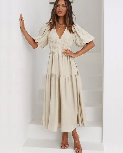 Dames midi-jurk met V-hals en pofmouwen