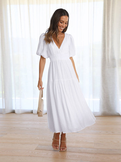 Dames midi-jurk met V-hals en pofmouwen