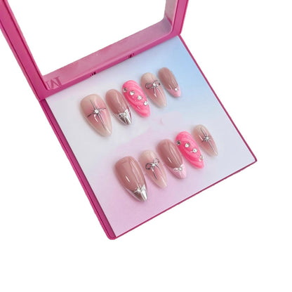 Luxe press-on nailartset met decoratieve steentjes en strikaccenten