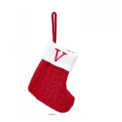 Mini-kerstsok met kabelpatroon en geborduurde initiaal