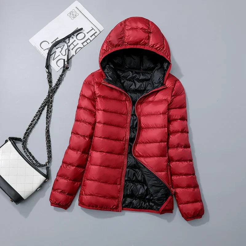 Omkeerbare donsjas voor dames met getailleerd silhouet