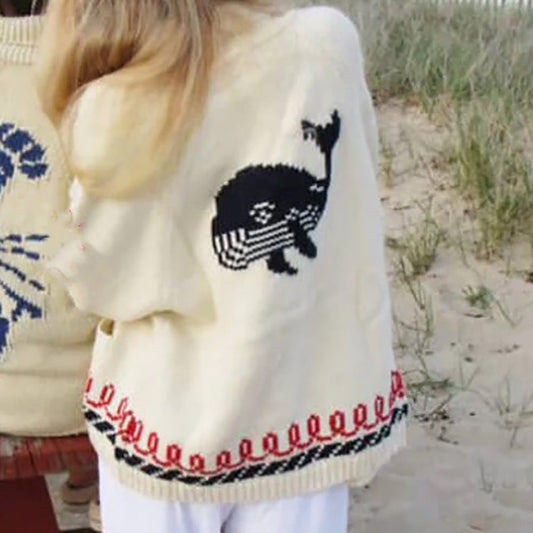 Oversized gebreid damesvest met walvismotief en nautische contrastbies