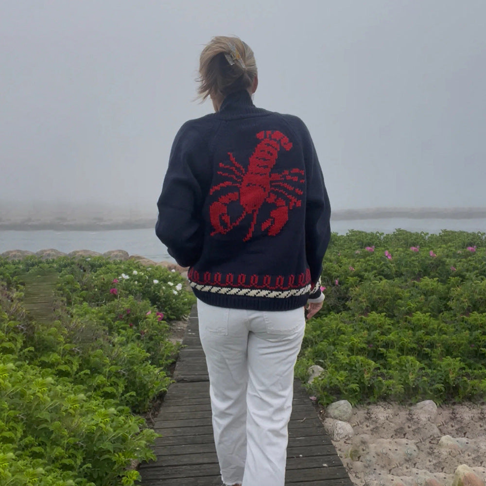 Oversized gebreid damesvest met walvismotief en nautische contrastbies