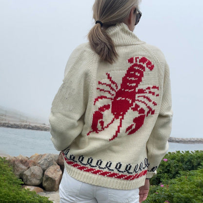 Oversized gebreid damesvest met walvismotief en nautische contrastbies