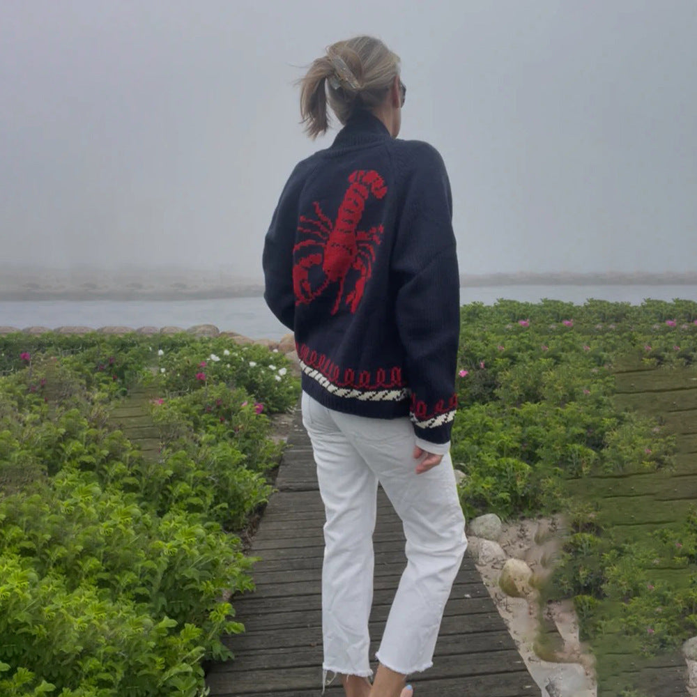 Oversized gebreid damesvest met walvismotief en nautische contrastbies