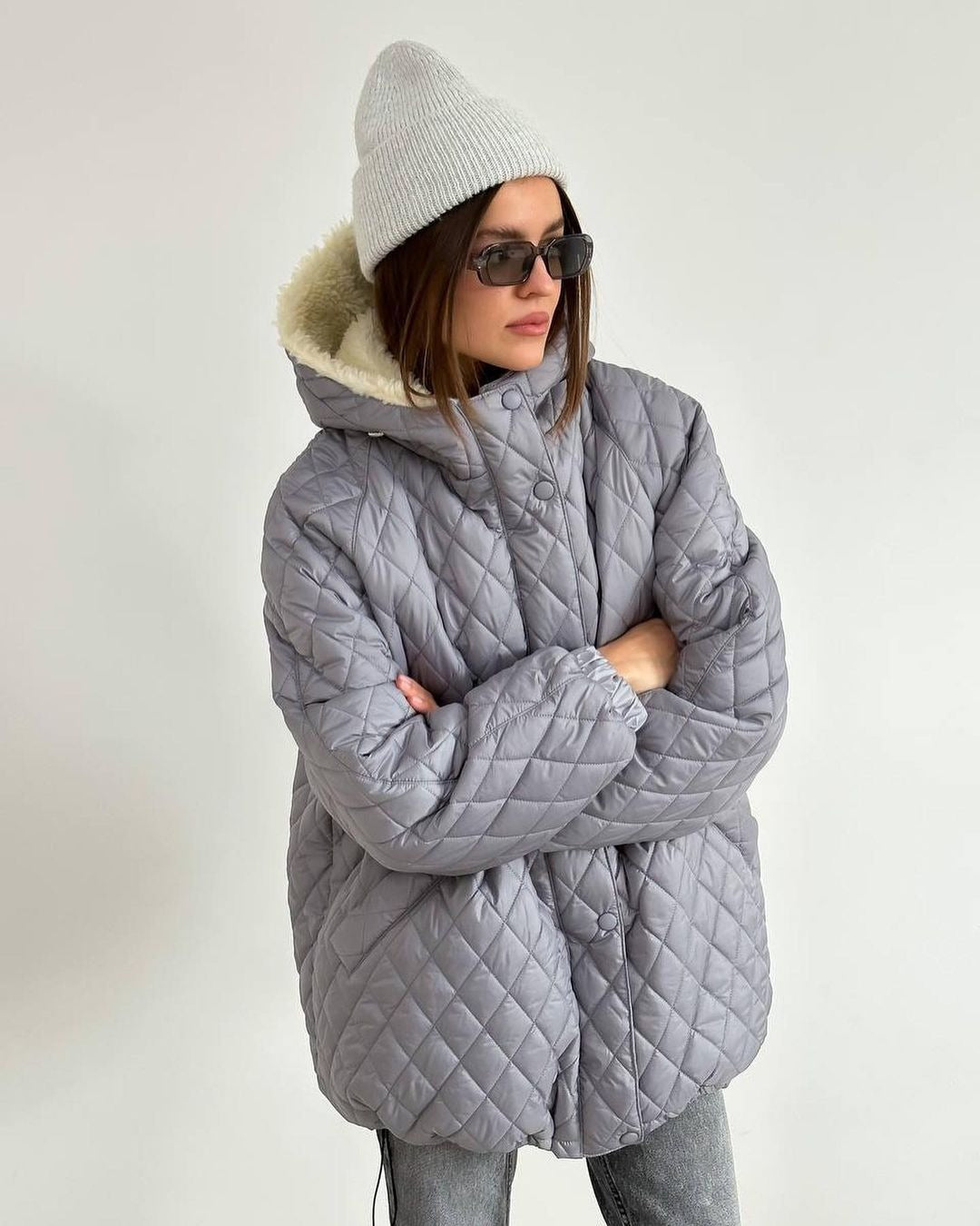 Oversized gewatteerde damesjas met teddyvoering en capuchon