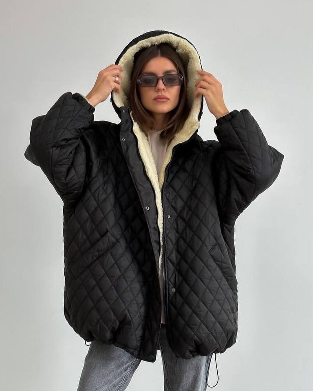Oversized gewatteerde damesjas met teddyvoering en capuchon
