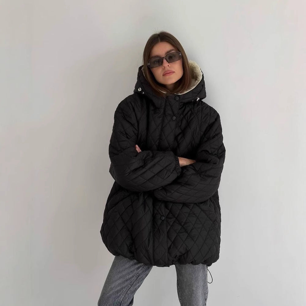 Oversized gewatteerde damesjas met teddyvoering en capuchon