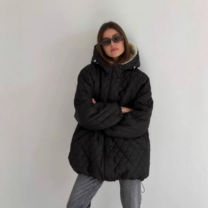 Oversized gewatteerde damesjas met teddyvoering en capuchon