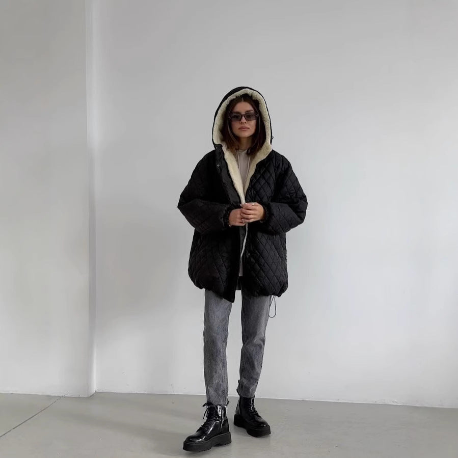 Oversized gewatteerde damesjas met teddyvoering en capuchon