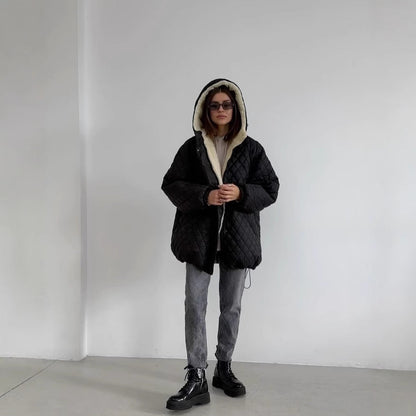 Oversized gewatteerde damesjas met teddyvoering en capuchon