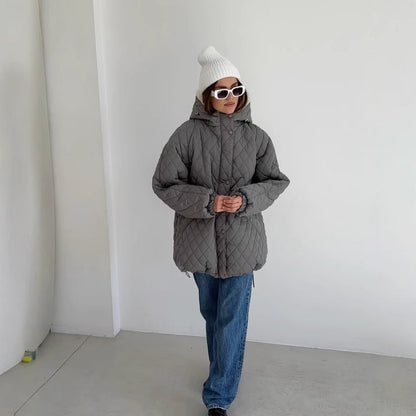 Oversized gewatteerde damesjas met teddyvoering en capuchon