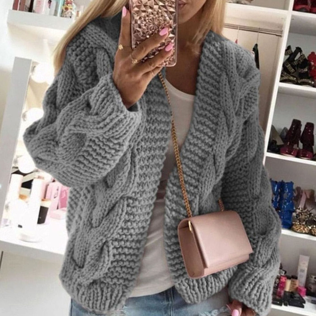 Oversized openvallend grofgebreid damesvest met kabelpatroon