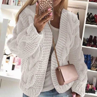Oversized openvallend grofgebreid damesvest met kabelpatroon