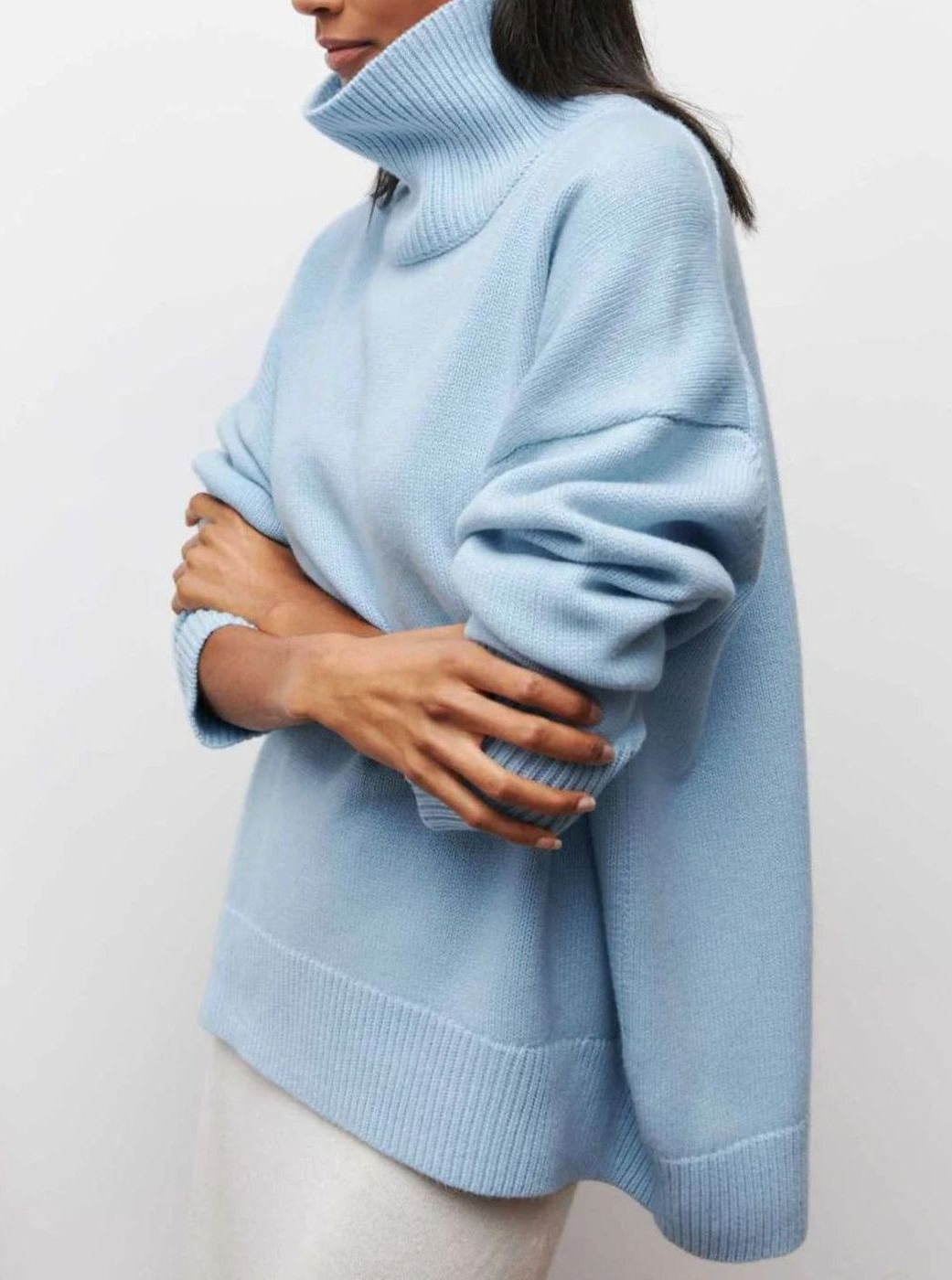 Oversized ribgebreide dameskoltrui met elleboogsplit