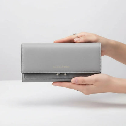 Ruime damesportemonnee met telefoonvak en elegante details