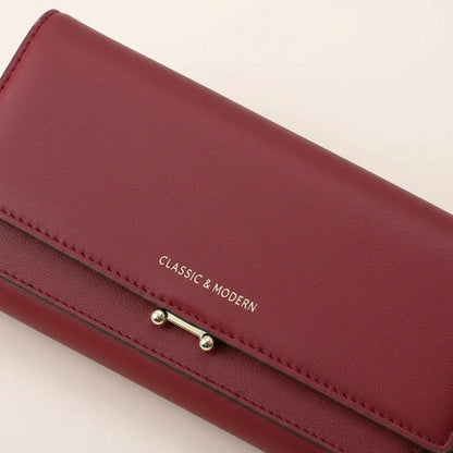 Ruime damesportemonnee met telefoonvak en elegante details