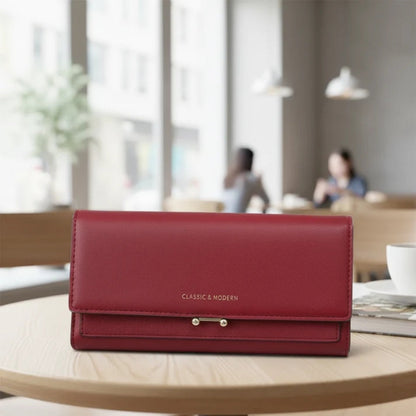 Ruime damesportemonnee met telefoonvak en elegante details
